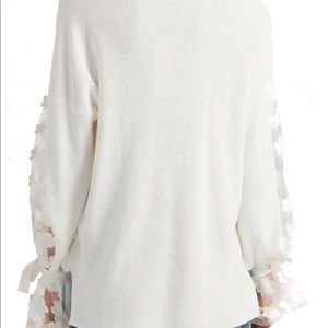 French connection Cotten sweater with shear flowered poet sleeves